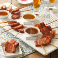 Bacon Lollipop Sampler with three sauces: Vanilla Bourbon, Honey Mustard, and Carribean Dark Rum.